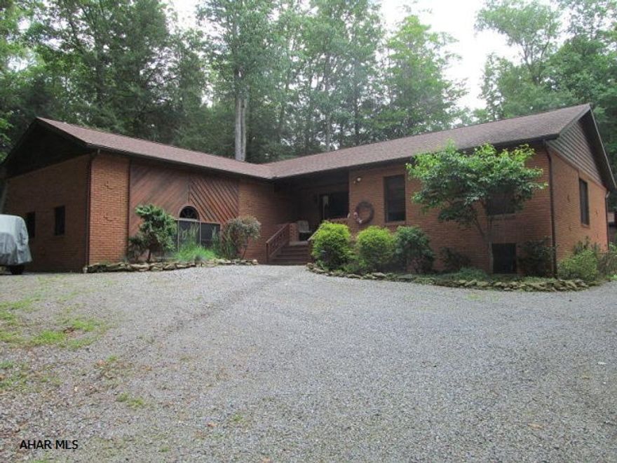 This beautiful spacious brick ranch on 1 +acre features 3 BR, 2 baths Master BR w/ walk-in closet.Formal LR & DR, french doors opening from the LR to a lovely covered deck, great for entertaining. Sunken Great room with Cathedral ceiling Oil HW heat, 5 zones & central air. There is also a detached cedar garage large enough to house a RV. Minutes from prince Gallitzin State park.