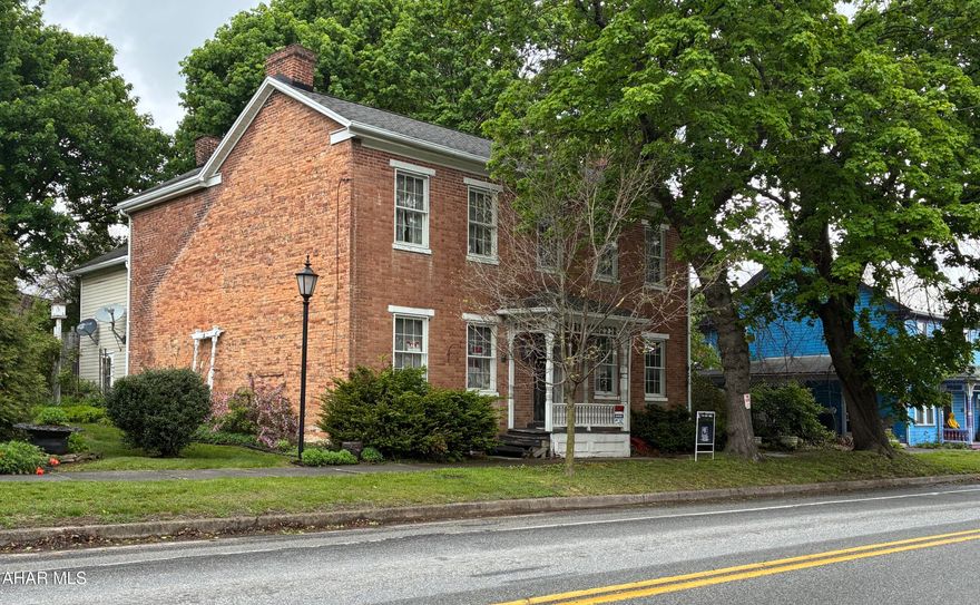 Own a piece of local history with this unique 1815 built home. Charm emanates from every corner of the home.  Original leaded windows, beautiful center hall entry way. 5 fireplaces to warm your soul on winter nights. Located in the heart of Schellsburg, the home is one of the original buildings in town. 4 upstairs bedrooms, one of which is a ''backstairs'' bedroom, accessible from the eat-in kitchen. newer appliances come with the home.  
Wide plank wooden floors will glow radiantly with a little TLC.  One bedroom has a porch looking out over the park like back yard. There are many antiques in the home, that can come with the house.  (Some items are marked ''KEEP'' and are going with the Executrix of the estate.  The home is definitely a diamond in the rough, but will polish up in to a very collectable gem, with the right owner with great aesthetic tastes, and a penchant for historical restoration.