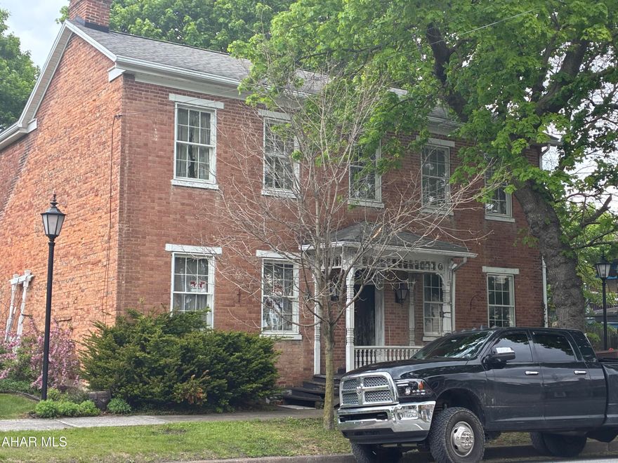 Own a piece of local history with this unique 1815 built home. Charm emanates from every corner of the home.  Original leaded windows, beautiful center hall entry way. 5 fireplaces to warm your soul on winter nights. Located in the heart of Schellsburg, the home is one of the original buildings in town. 4 upstairs bedrooms, one of which is a ''backstairs'' bedroom, accessible from the eat-in kitchen. newer appliances come with the home.  
Wide plank wooden floors will glow radiantly with a little TLC.  One bedroom has a porch looking out over the park like back yard. There are many antiques in the home, that can come with the house.  (Some items are marked ''KEEP'' and are going with the Executrix of the estate.  The home is definitely a diamond in the rough, but will polish up in to a very collectable gem, with the right owner with great aesthetic tastes, and a penchant for historical restoration.