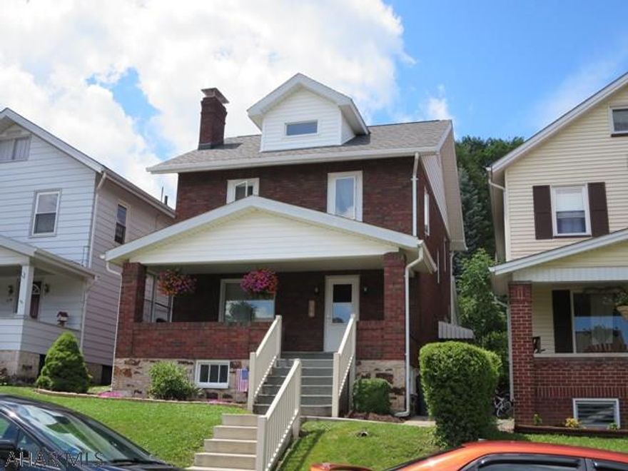 Welcome home to this beautifully updated 2 1/2 story brick home featuring 3 bedrooms, spacious kitchen with new stainless appliances, original brick fireplace with gas insert, and central air conditioning.  The finished attic can be used as a 4th bedroom or office.  The patio and all season room off of the kitchen is ideal for your summer gatherings.   This is a must see home and won't last long!  Call today for your personal showing.