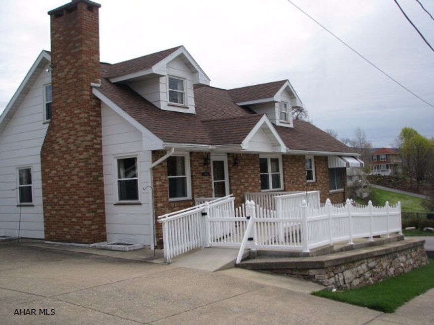 Spacious Cape Cod on corner lot in a quiet neighborhood.The 1st floor's open floor plan gives you plenty of space for whatever your needs may be.  Whether it be entertaining or just relaxing by the fireplace.Laundry on the 1st floor is an added bonus that many of us would love to have. Off the eat in kitchen is a porch which runs the entire length of the home.From this vantage point you will have beautiful views of the mountains.The second floor has two large bedrooms and a full bath.If after all this you still are looking for more room you will find it in the lower level. The family room is finished and a large utility room with a partial bath.An integral one car garage along with a detached brick two car garage rounds out all this home has to offer. 3 zoned baseboard heat for efficiency.