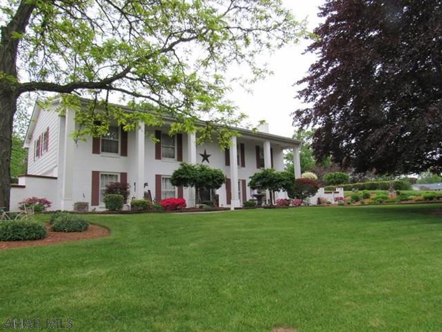 This spacious Raised Ranch has plenty of curb appeal with its beautiful landscaping coming into bloom!  Located in a peaceful setting, you will enjoy relaxing in the all-season sun room with attached paver patio, or entertaining family and friends in the full wet-bar dining area on the lower level.  Full well-manicured gardening surrounds the home outside, and you will appreciate the storage shed on the premise.  In the winter, you have your choice of 2 natural gas fireplaces to keep you cozy.  There is plenty of storage here, including the 2-car heated garage.  Don't forget to wind down and have some fun in the Spa room with Hot Tub and skylight!