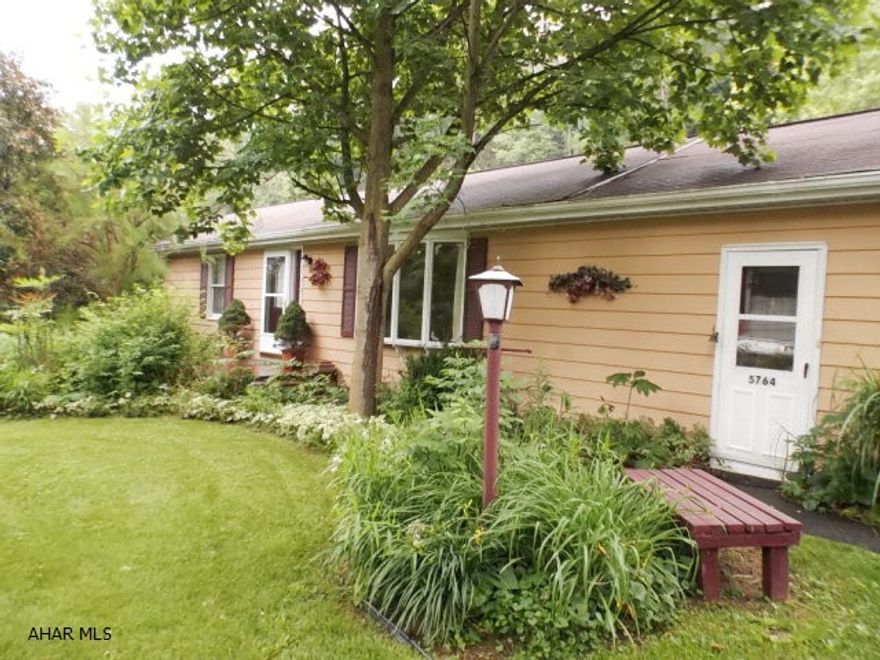 Well built ranch with large yard.  Originally a three bedroom, wall was partially removed to create a larger bedroom.  Wall easily replaced to restore to three bedrooms.  Two car garage plus a carport.  Basement area is potential inlaw suite with private entrance.  Kit. fridge is 2 years old.  Fenced area for children or animals.  Property backs up to woods.