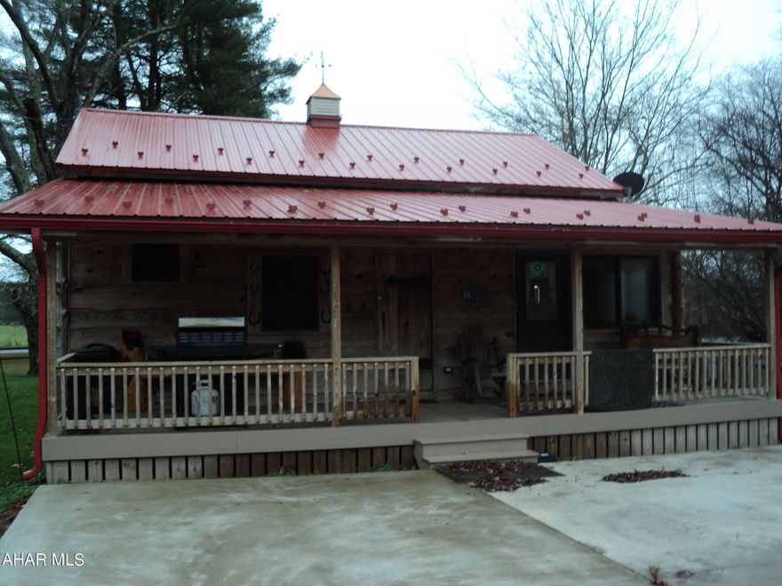 What an AWESOME ''getaway'' or a permanent residence.  This cozy cottage has much to offer, and you don't have to call a moving company as it is being sold furnished with like new furniture and appliances.  Just bring your own washer and dryer.  Recently installed Fir siding, metal roof, thermal pane windows, electric mini split heat and air conditioning system and electric baseboard heaters.  The rear porch is enclosed. the yard features a 12 x 16 gazebo, and there is a swing that overlooks Dunning Creek. Great fishing.   The property borders Dunning Creek (great fishing). The lot has RV parking with a public sewer tap There is a private well with a maintained water treatment system.  Square ft and acreage taken from county tax records buyer to verify.