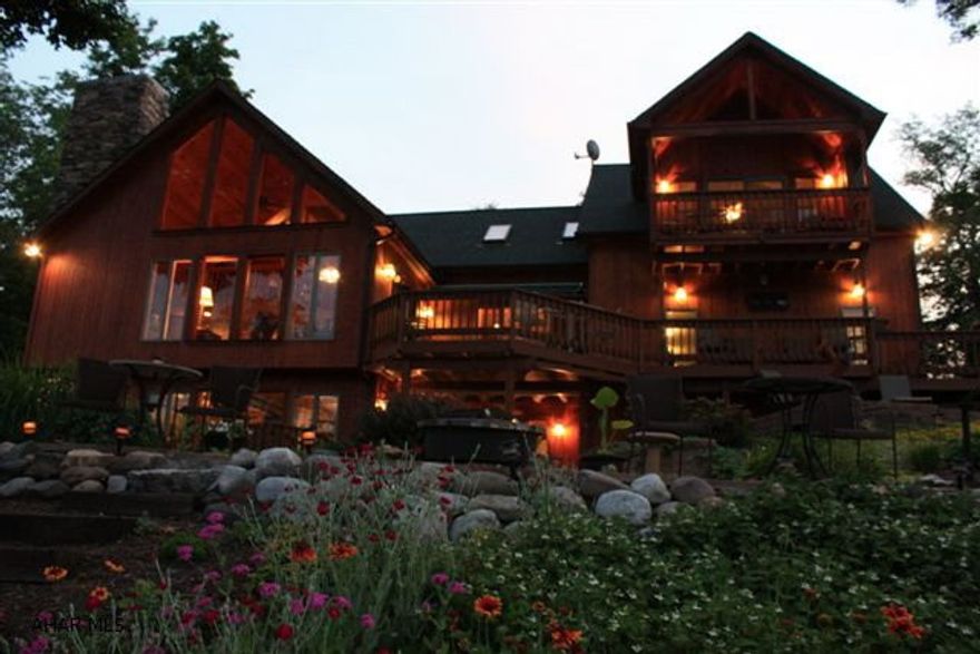 Breathtaking views at Raystown Lake and Resort Area. Custom designed cedar home on 1+ acre minutes from the lake. Custom landscaping provides gorgeous gardens every season. Multi level decks let you retreat to your own private spot or entertain a large crowd. Stone and cedar 2 story home with wide open floor plan. Custom stone fireplace in LR. Open custom kitchen. Double Koi pond with 90 ft circulating stream. Radiant heat including basement and garage, dual air conditioner/heating system. Vaulted ceilings. Floor to ceiling stone fireplace with lower level FP ready. 2 wells plus 1000 gallon cistern. Boarders Army Corp of Engineers property and Bald Eagle habitat. Custom railing and steps lead to loft and continue across walk way to Master. Suite. This property has it all!