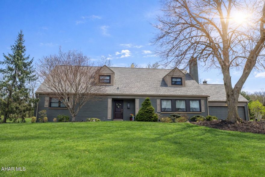 Nestled on approximately one acre at the prestigious corner of Blairmont Terrace and Sylvan Drive, this beautifully updated and impeccably maintained brick home offers timeless character in one of Hollidaysburg's most sought-after locations, directly across from the Sylvan Hills Golf Course.

Rich in character and classic charm, this exceptional residence blends timeless craftsmanship with thoughtful modern updates. From the moment you step inside, you're welcomed by rich dark-stained hardwood floors flowing throughout the main level and into the expansive living room, centered around a stunning wood-burning fireplace and beautiful built-in cabinetry that adds warmth and sophistication.

Featuring 4 spacious bedrooms, (including a generously sized main-floor bedroom) 3.5 bathrooms, and a versatile bonus room perfect for a home office, nursery, or potential 5th bedroom, this home offers both elegance and flexibility for today's lifestyle. 

The beautifully updated kitchen is truly a showpiece, featuring tasteful finishes, under-cabinet lighting, ample outlets, and exceptional storage throughout. Just off the kitchen, an elegant butler's pantry and beverage center with a built-in wine refrigerator creates the perfect space for entertaining.

Upstairs, the spacious primary suite serves as a private retreat, complete with a beautiful built-in wall dresser, abundant closet space, and an en-suite bath featuring a jacuzzi tub and separate stand-up shower. 

Storage in this home is simply unmatched, with endless space thoughtfully integrated across every level.

The lower level offers incredible potential with new flooring throughout, a half bath, and expansive space that can easily be finished for additional living, recreation, or entertaining space.

Step outside to your own private oasis featuring a large screened-in back patio and a stunning in-ground saltwater pool, perfect for relaxing or entertaining.

With its stately brick exterior, timeless character, custom built-ins, exceptional updates, and premier location, this is a rare opportunity to own an extraordinary home.