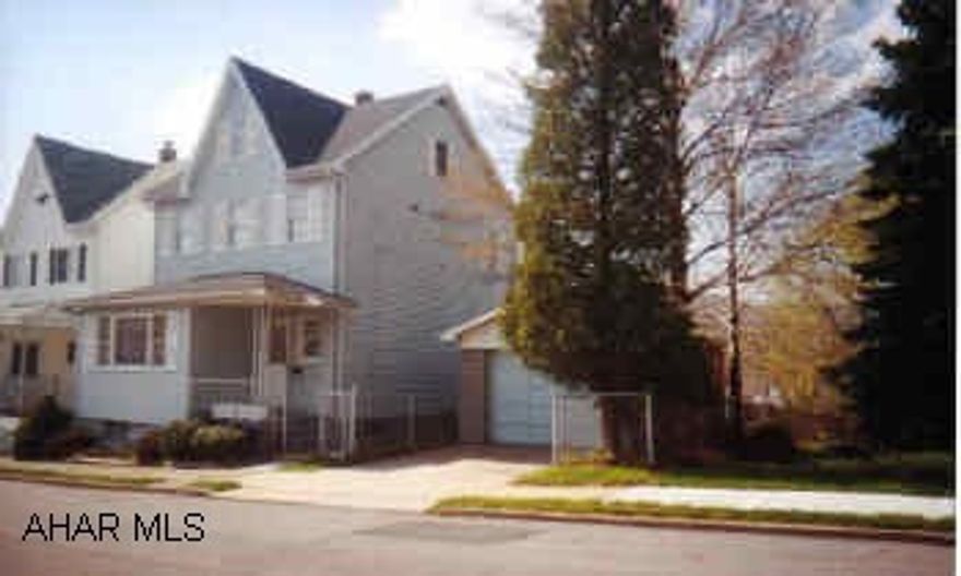 2.5 story vinyl sided on double lot with garage facing street. Absolute move in condition.  Nicely decorated.  Deck with view.  Seller reserves small lilac bush in back.  Central air.