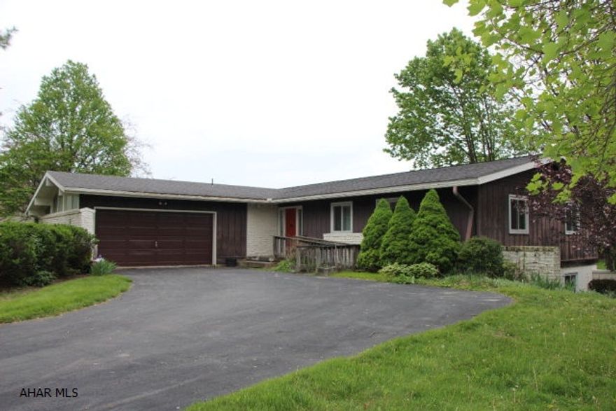 This 3,200 square foot ranch home has great potential and is looking to be updated! 4 bedrooms with 3.5 baths, 2 car garage and wrap around deck. Recently remodeled kitchen. Cathedral ceiling in living/dining room. 2 fireplaces, 3 zoned hot water heat. Hollidaysburg Area School District. Must see!