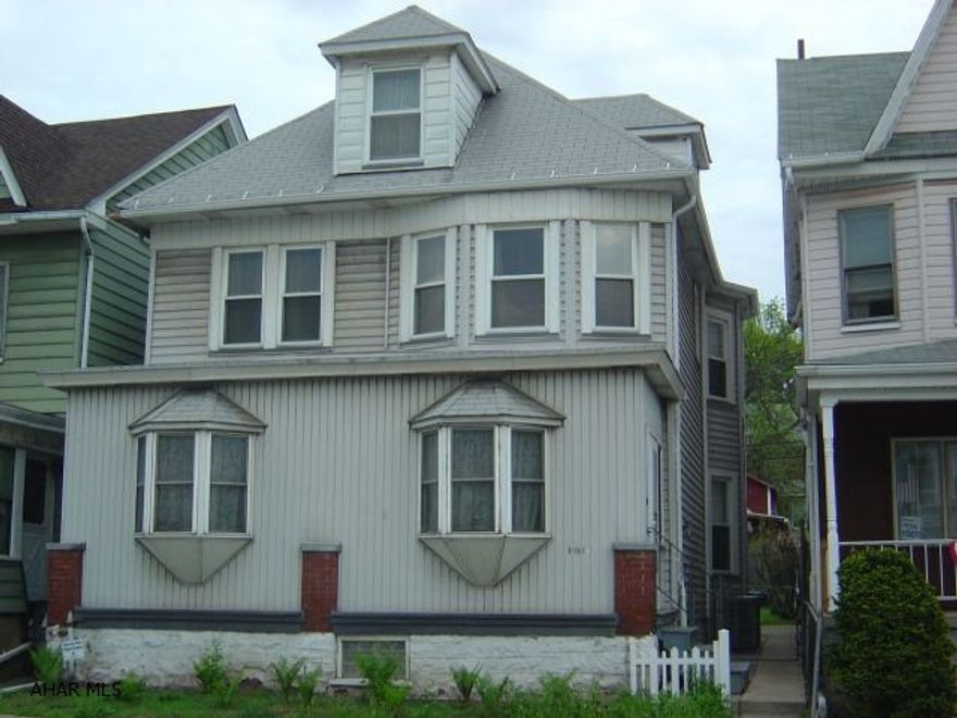 4/5 Bedroom, 3 bathrooms, living room with fireplace. Garage and carport, newer roof, furnace, windows, electric, 1st floor laundry, hardwood floors, could possibly be a duplex, excellent condition, beautiful woodwork.