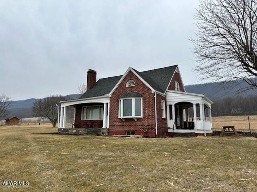 Beautifully maintained brick Cape Cod home just two miles from the Shy Beaver boat launch at Raystown Lake! This charming property features stunning hardwood floors throughout, offering warmth and character in every room. With 3 spacious bedrooms and 2 full bathrooms, it's perfectly suited as a comfortable family home or the ideal vacation retreat for those seeking peaceful living just minutes from the lake. Enjoy breathtaking sunsets from the inviting side porch, or gather with loved ones in the cozy eat-in kitchen designed for everyday comfort and connection. Custom built with care and quality craftsmanship, this home offers timeless style, durability, and a location that combines quiet surroundings with easy access to outdoor adventure.