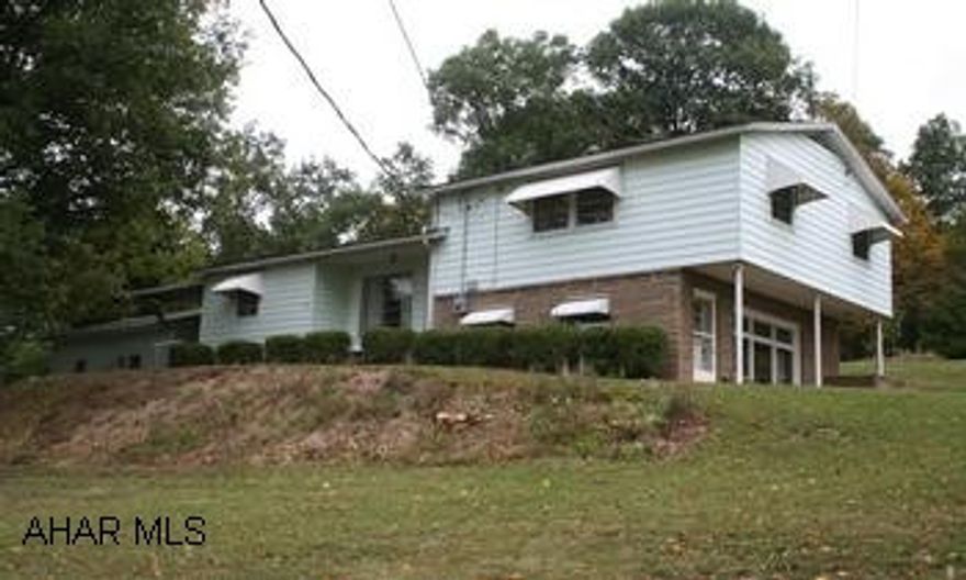 Tri-level house on picturesque lot with large trees and views. Private setting. Spacious living room , cozy family room with fireplace. Stained glass adds character to dining room, 2BR/1BA. Home Warranty.