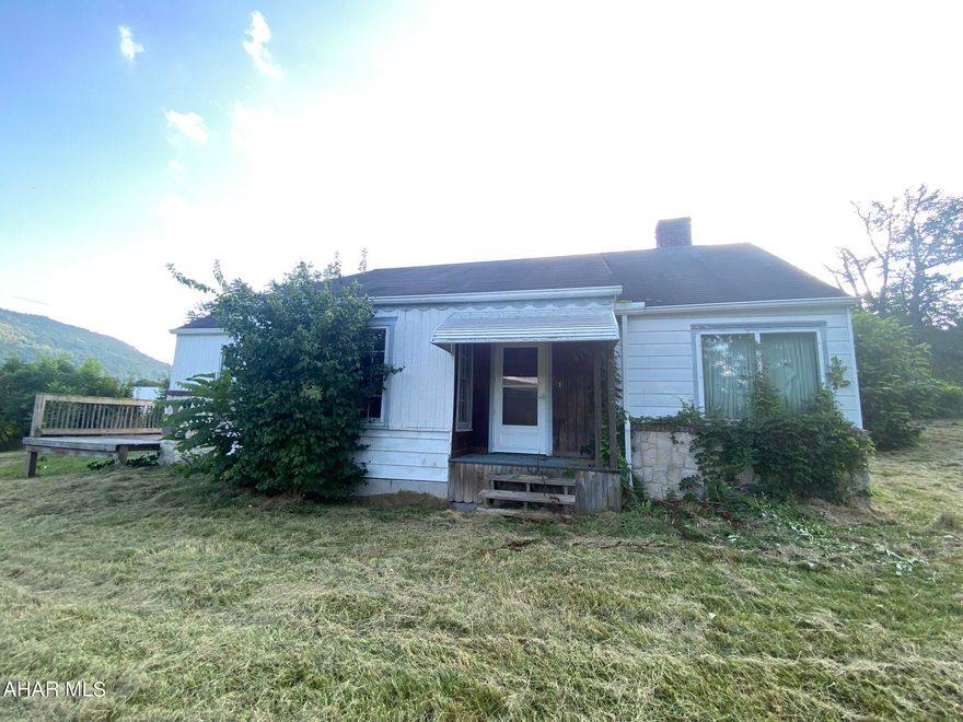 Classic 2 bed 1 bath ranch home in convenient location just outside of Bedford! Would make a perfect starter home or single floor downsize. Main floor has kitchen with newer stainless appliances, bonus room/den, two bedrooms, dining room, living room with wood fireplace and a full bath. Basement has an integral one car garage stall. Land is spacious with just under an acre of yard. Lots of parking. Set up your showing today!