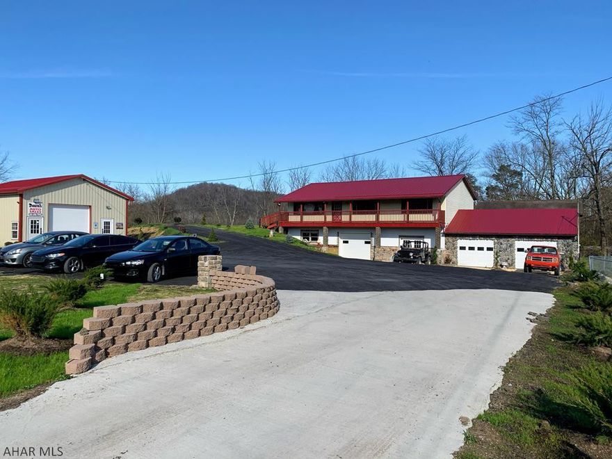 Are you looking for garage space? Many possibilities with this 3bd 1 ba raised ranch home that offers 7+ garages, a large kitchen that's open to dining area and an updated bath with laminate flooring, new roof, deck, stone work, landscaping  and new well on a fenced in .71 acre lot with a parking lot. The metal building is set up as a car sales office and the other side is a hair salon w/ a half bath.