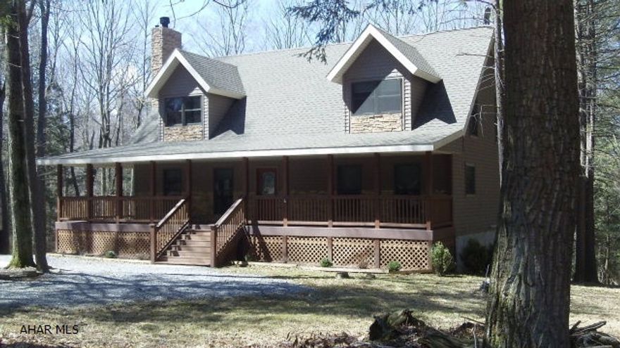 This home is a gem and must be seen to appreciate it.  Sitting on a private, wooded lot in Glendale Yearound a covered deck wraps around 3 sides of the home.  Enter in the front door to a gorgeous great room with cathedral ceiling and stone fireplace.  The eat-in kitchen includes a Kitchen Aid electric range and refrigerator, both stainless steel.  A deep, soaking tub is in the 1st floor master suite.  Two additional bedrooms are on the second floor along with a full bath and a sitting area at the top of the stairs that overlooks the great room.  French doors are featured in the walk-out finished basement family room where you can warm up with your wood stove.  A 3/4 bath, bonus and utility room finish out the basement.  Gated community is adjacent to Glendale Lake. Home warranty included