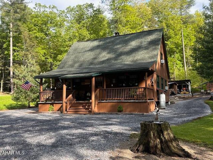 Once in awhile you will come across a spectacular place that just fits all the bells and whistles of the home of your dreams. Regardless of the reason that you are looking for a property such as this, rather it be year round living or a week-end hide away, you will not want to miss checking this one out. After crossing your own covered bridge, you will find nestled in the woods this adorable home. This retreat sits off the beaten path and away from neighbors.  Surrounded by nature, the wildlife is abundant and the solitude of the mountains perfect. This property borders State Games Lands and Black Log Creek Runs along the edge. A great place to relax and get back to the country. Regardless if hunting, walking, target shooting or just enjoying the wilderness is what you are looking for this property offers it all.  What even makes this property more wonderful is that it is turnkey, everything that you see when you visit will be included, from the gas grill down to the dishes and silverware. Get ready to relax and enjoy.