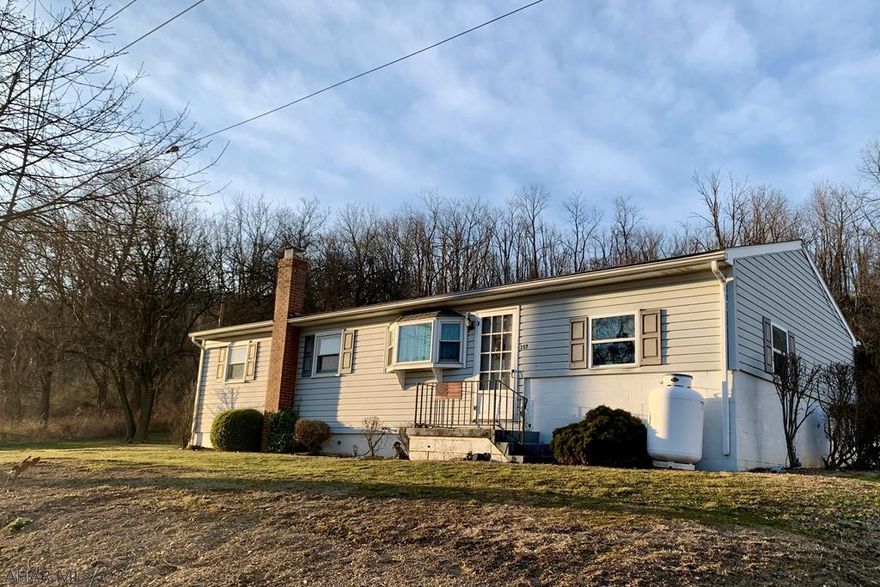 If you are looking for first floor living, step inside this cozy home that is conveniently located a short distance from downtown Bedford and easy access to I99 and PA turnpike.  This home offers a bonus room that is heated, eat in kitchen that opens up to the living area for everyone to enjoy, 3 bedrooms and 1 full bath.  Washer and dryer are located in basement and are included.  Outside you will find a 1 car garage with an additional carport attached, nicely maintained yard and storage shed.  Updates over the last several years includes a water softener, oil tank, metal roofs on the garage and shed, and roof on the home itself.  Whether you are looking to downsize or just starting out, this home with some updating and your own personal touches could be just the place to call home.