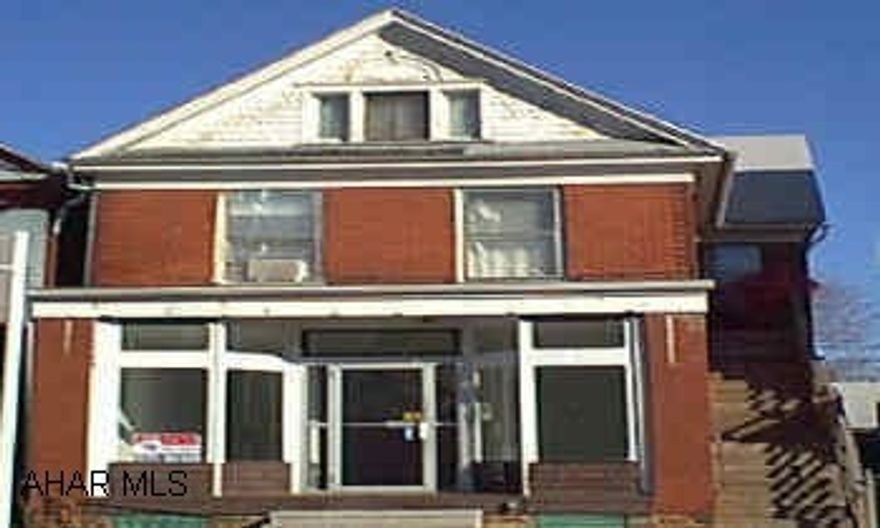 Brick Veneer - 2 Story Nice investment property, Large storefront with an apartment above, Parking in rear for 3 cars.Tenant occupied, must have confirmation for showings.