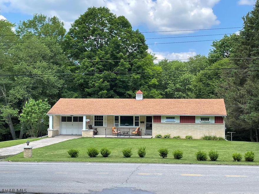 This extremely well-maintained three bedroom 1 1/2 bath brick ranch sits on a beautiful lot in Cresson Township.  Walk into the bright living room that features hardwood flooring and newer picture window.  The spacious kitchen/dining is great for family meal time or for entertaining.  Completely updated kitchen, all appliances included.  The finished bonus room would be great as an office, workout space or den. There are three nice size bedrooms and full bath on this floor.  The bathroom has been completely renovated - features tile flooring.  The basement has 1/2 bath and spacious family room.  Bonus storage area under garage.  Large lot is very private in the back.  New roof, windows, radon system.  Call today!