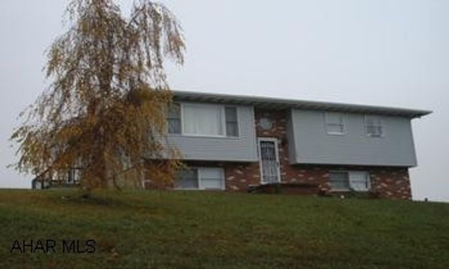 Great split entry on one acre.  Three bedrooms, one and 3/4 baths, enclosed sunroom, one car integral garage.  Great split entry on one acre.  Three bedrooms, one and 3/4 baths, enclosed sunroom, one car integral garage, and close to town. Great rural living yet close to town.