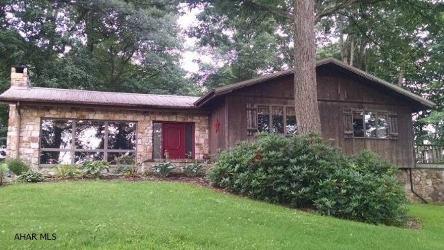 What a lovely, unique custom built, contractor owned rustic home. Absolutely beautiful wooded setting. Very spacious 3 bedroom, 2 bath ranch, spa room, workshop/office, 7 bay kennel and much more on a 1.15 acre lot. Must See!