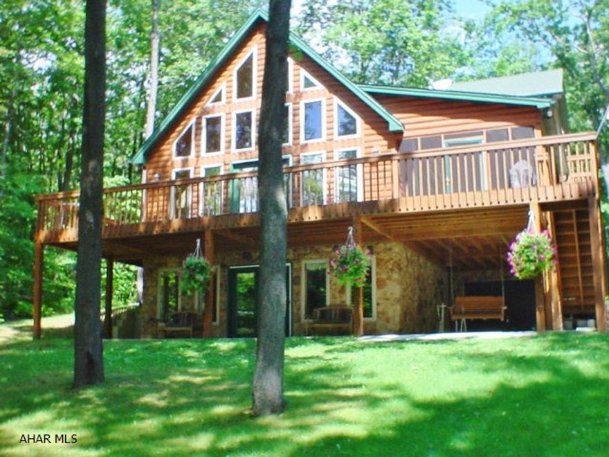 Gorgeous custom built home, full furnished with beautiful furnishings. Fully equipped for the most discriminating buyer. Scenic double lot to enjoy year round. Golf, snow shoe, or cross country ski out your door. Close to slopes. Dues include use of pools, tennis courts, & trash removal.