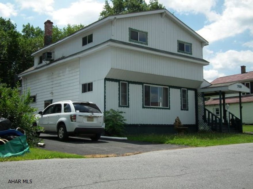 Large 4 Bedroom home with 100x120 (.275 ac) lot above ground pool (last opened 2013). Will need work but great potential! Off street parking in driveway + additional paved area on side.