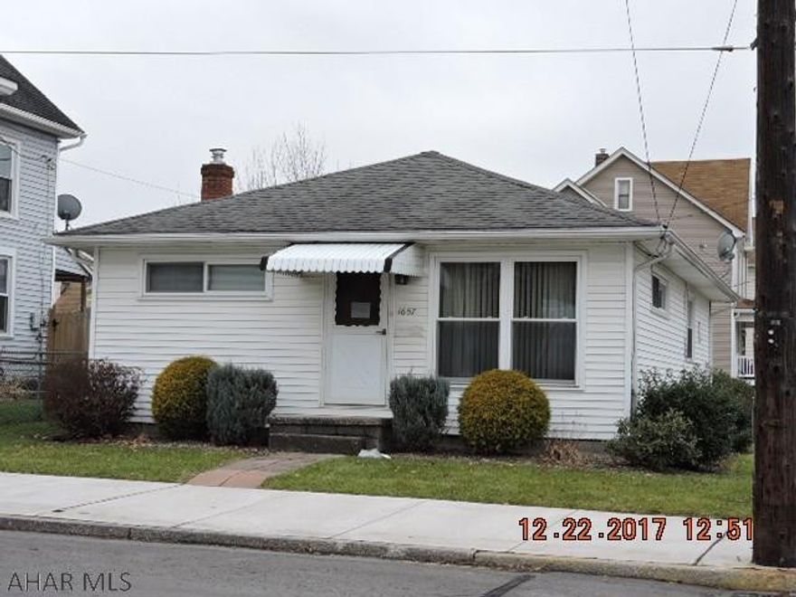 Sweet bungalow on nice corner lot.  Hardwood floors throughout.  Bath Fitters remodeled bath.  Modern mechanics.  200 AMP Service in garage.  Garage has frost free water tap.  100 AMP electric service in house.