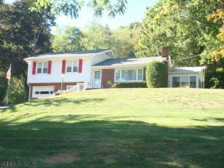 This lovely multi level home is located in an upscale neighborhood. Along with its picturesque setting on the hillside, this property offers spectacular views of the Tyrone area and the surrounding mountains. The property boasts three bedrooms, two bathrooms, eat in kitchen, living room with fireplace, formal dining room with bay window, a three season sun room, a family room and a one car garage. Other features include a natural gas hot water heating system with three zones, central air conditioning, thermopane windows, newer roof, newer exterior painting, large closets in each of the bedrooms, a 200 amp electrical system, and hardwood floors throughout. Meticulously cared for and gently lived in over the years, this one owner quality built home by builder Reed Johnson, shows no wear.