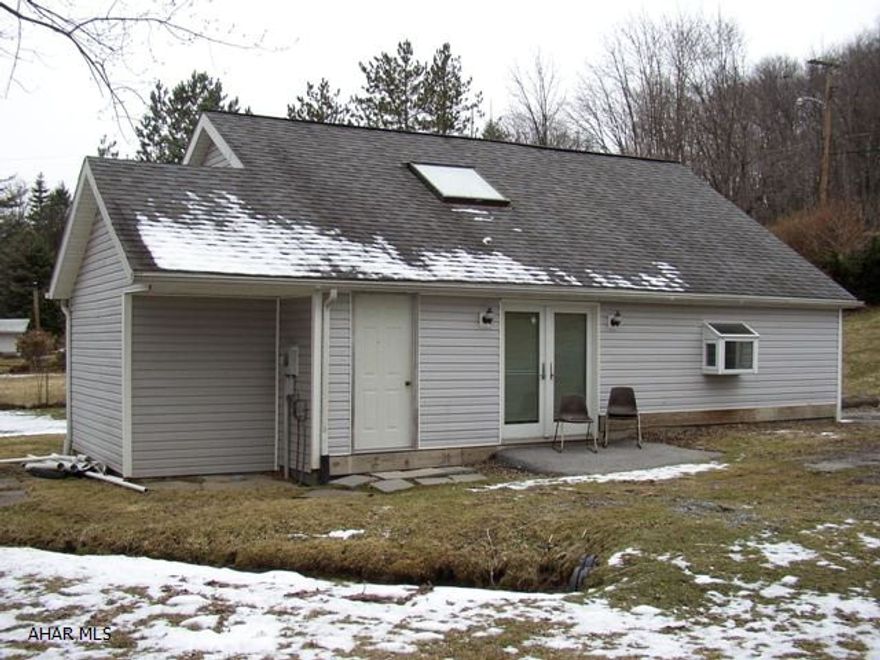 Contemporary loft house next to Altoona Penn St. campus.  This unique house offers private office space, large open floor plan and large loft area.  The sale includes all appliances.  The oversized lot is usable for recreation or expansion.  In summertime sit on your rear patio and listen to the tranquility of your own stream.  This home is priced to sell.