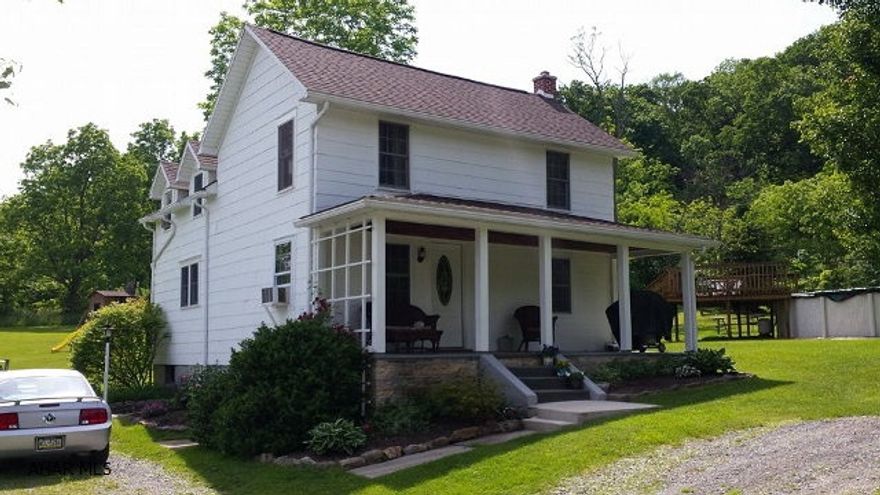 RARE FIND AND ONE OF A KIND. Very well maintained country home on approx. 15 beautiful acres. This home has a private setting but convenient to town. Many new updates including new flooring and roof. Home is 2 bedroom (could easily be converted back to 3)  one bath and a large country kitchen. It sits on a gorgeous open and wooded 15 acres. Enjoy entertaining in the spacious dining room while admiring the views through the oversized windows. Watch wildlife from the peaceful covered front porch. Swim in the 27' above ground pool and relax on its deck. This home has so much character and so many wonderful features that makes it truly one of a kind. It's a MUST SEE!