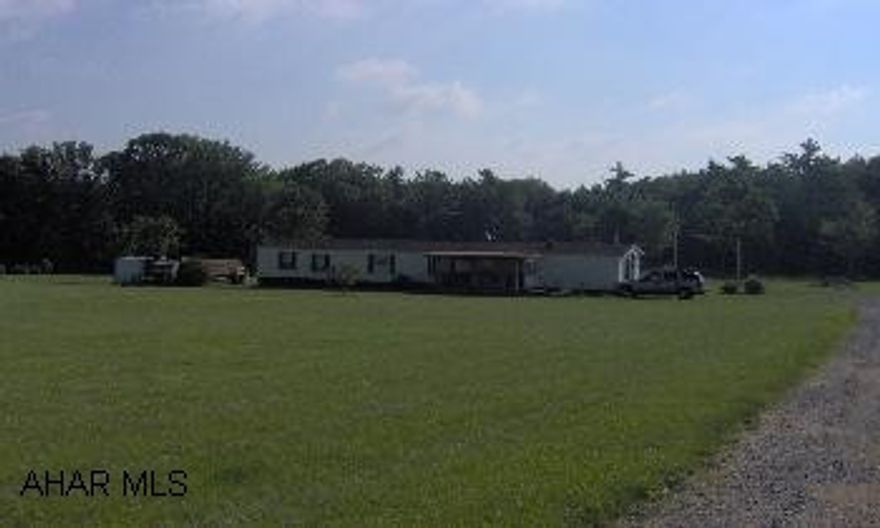 1991 Park Hill 14x80 mobile home with addition on 5 acres. Two ponds, well and sandmound. Nice property and location.