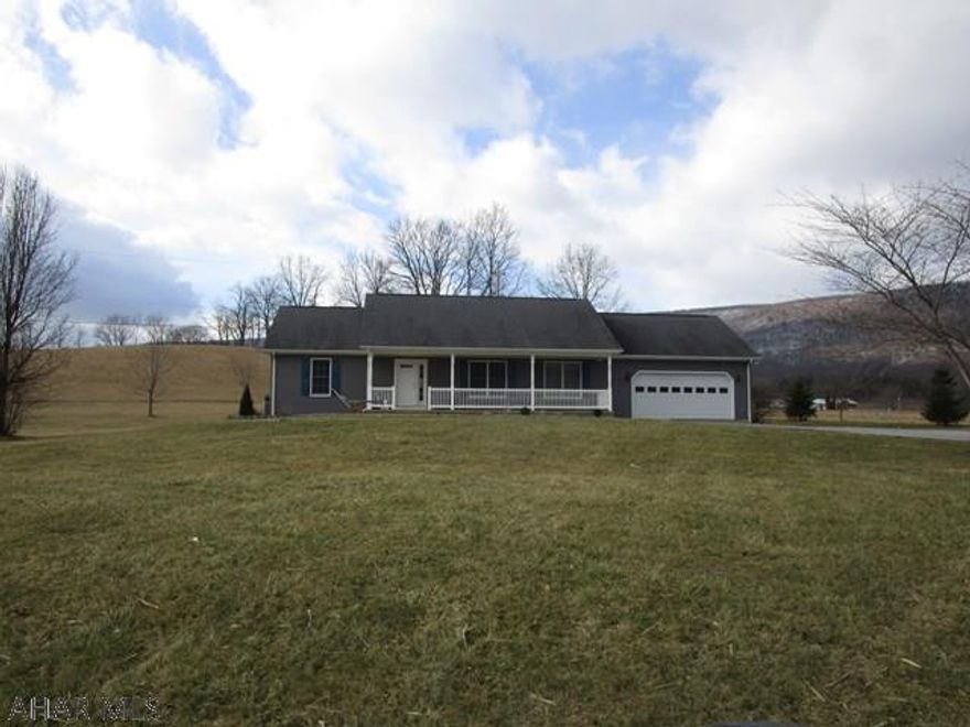 This well maintained ranch home rests on 1.4 acres and offers some great mountain views from the back yard!  The main level has a LR, Kit w/breakfast bar, DR, Laundry Room, master bedroom w/ walk-in closet and master bath, two additional bedrooms and a full bath.  Oak hardwood floors throughout the main level.  The full basement offers a remarkable large recreation room w/ propane fireplace and timber slab bar.  Craftsman style finishing w/ knotty pine and stone walls, tin ceiling and recessed lighting.  Large relaxing front covered porch, rear covered porch, two-car attached and finished garage and a roomy parking area.  Heat pump with central air, 200-amp electric and electric hot water heater.  Built in 2004, this home has a peaceful country setting but easy access.