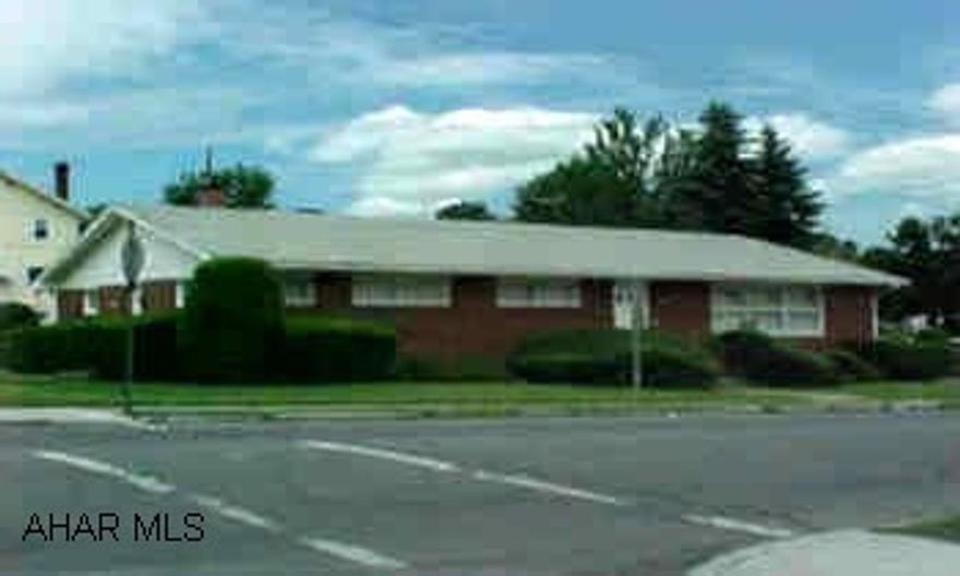 Nice one story brick office building on corner lot.  Built in 1964. Used as a Doctors office. Large reception area; 2 private offices; 3 exam rooms; restroom +kitchen