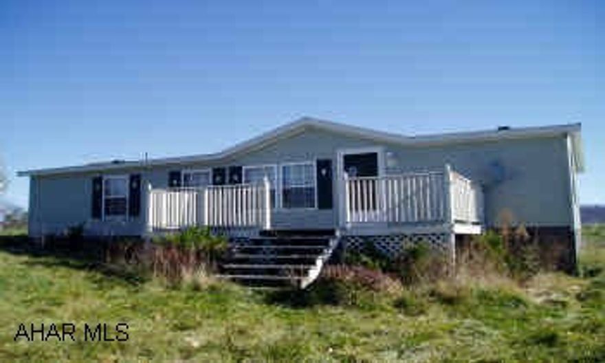 Nice Double-wide in good condition on large country lot with a beautiful view featuring a huge living/dining room and master bedroom suite. 6 Rooms, including 3BR,2BA, LR/DR, Kitchen w/dishwasher and oak cabinets, laundry room.