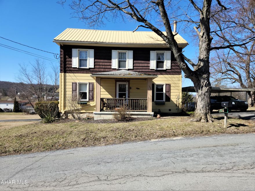 Attention buyers!  This is a hard to find, move in ready property in the Chestnut Ridge School District.  This charming 1920's two-story home features 2 bedrooms and 1-1/2 baths upstairs, with a third bedroom and 3/4 bathroom in the basement.  This home features an eat-in kitchen, a large living room and a family room with a brick fireplace.  You can snuggle up by the fireplace on those cold winter nights.  The detached one-car garage has a second level for storage.  A circular macadam drive has a two-car carport at the side entrance for your convenience. 
Nestled on over 2 acres, you have the feel of rural living while being close to the schools, shopping, Interstate 99, the PA Turnpike and all that Bedford County has to offer.  Square footage and acreage are from Public Records; buyer to verify.  Being sold 'As-Is', seller will not make any repairs.