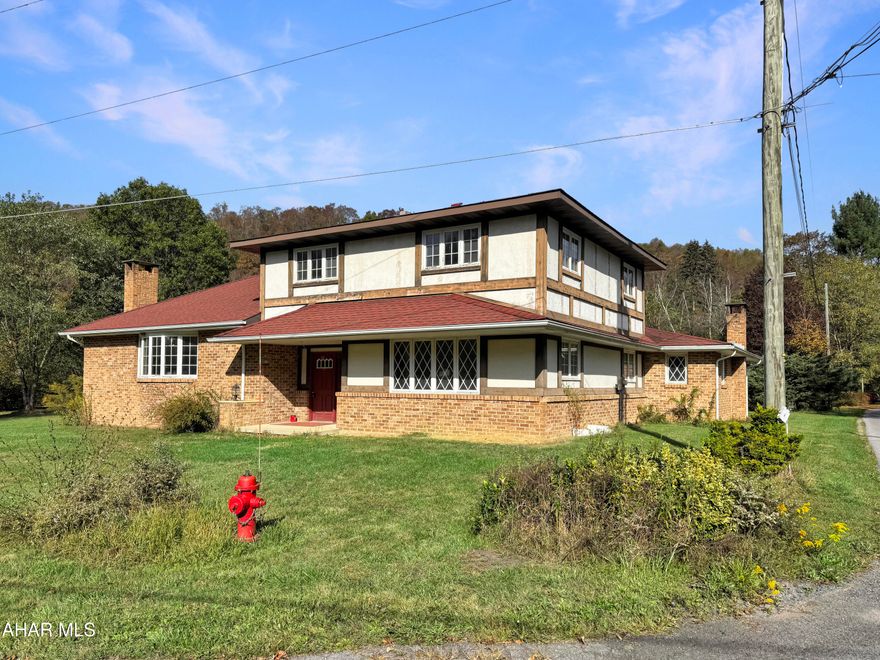 Welcome to 104 Twin Lakes Road, a one-of-a-kind opportunity in the Portage School District. Nestled on approximately 5.7 flat, scenic acres w/ river frontage along the peaceful Little Conemaugh River, this property offers endless potential. The stately home has been fully cleared out & is ready for your vision - an ideal blank canvas to create your dream residence. The main level offers a spacious foyer, a light-filled living room w/ a wood-burning fireplace, a dining room w/ access to a side patio, an open kitchen area, utility & laundry room, a half bath, a bonus office, & a large family room perfect for entertaining. Upstairs, you'll find three nicely sized bedrooms & a full bathroom. Outside, enjoy an attached two-car garage, a large detached garage, a generous shed, & expansive land w/ river views - perfect for relaxation or recreation! With its combination of natural beauty, privacy, & renovation potential, 104 Twin Lakes Road is a rare find. Schedule your tour today! Cash or Renovation loans ONLY! Sold ''AS-IS''.