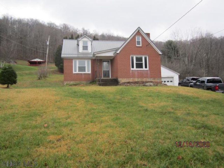 Well maintained 1.5 story brick home located out of town yet very close to in-town conveniences.