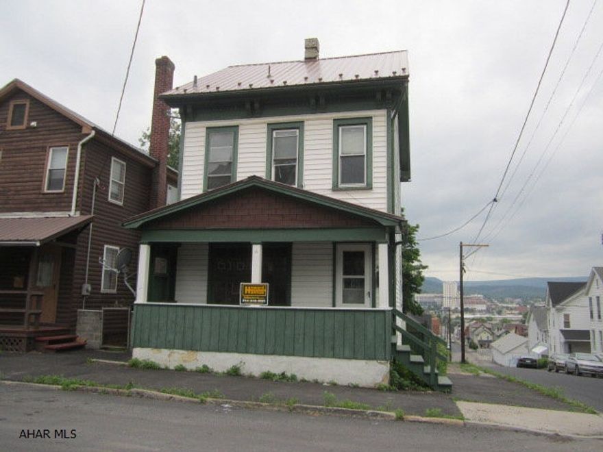 A vinyl sided home with detached garage. Features include new metal roof, most all replacement windows and finished 3rd floor.
