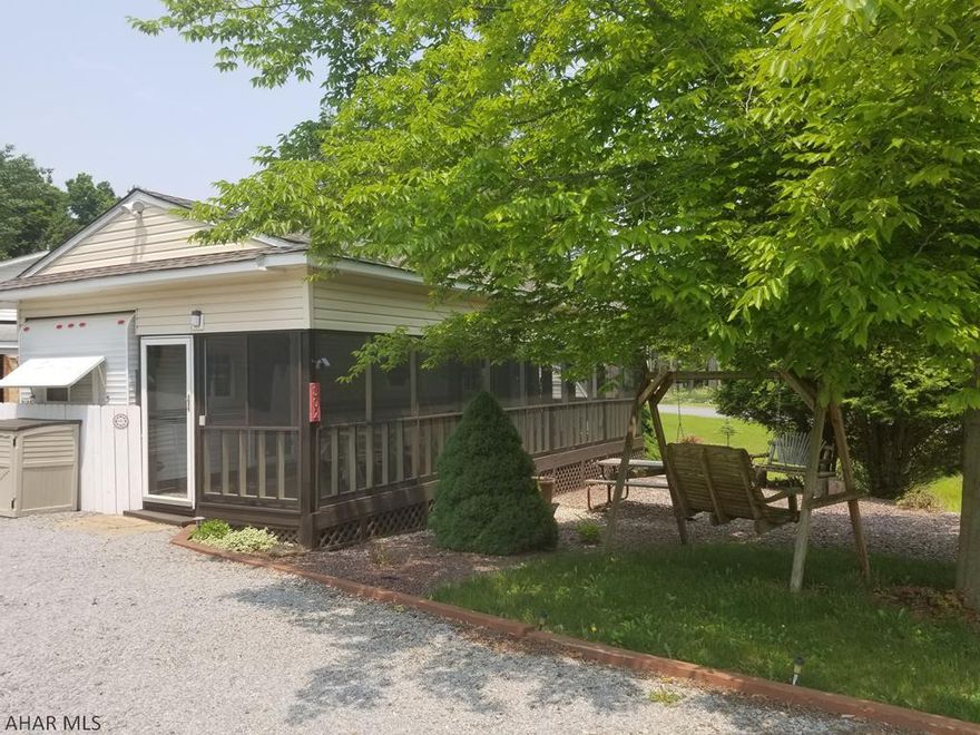 2002 Hyline Park model camper on 1 lot inside Glendale Yearound. This spacious camper has 1 bedroom and a bathroom with normal sized shower and toilet. This camper comes with a WASHER AND DRYER. This is a corner lot with a stream running right beside it. The pavilion has been recently painted and the deck has new screening. A small shed and a new firepit area are behind the camper. The roof is only 1 year old. The electrical service has been upgraded and new motion lights installed all around the property. Glendale Yearound is a gated community located minutes from Glendale Lake and Prince Gallitzin State Park. Community Pool, Basketball, Tennis, Security, and more.