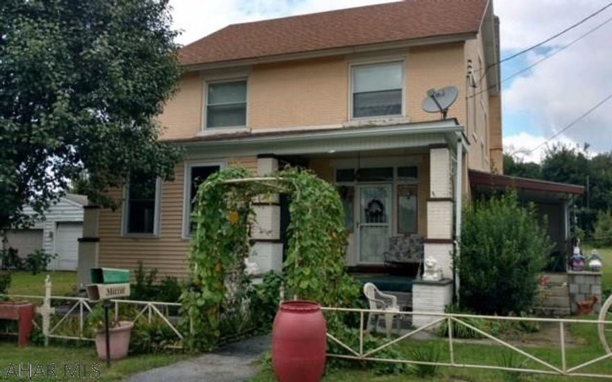 This unique property offers so much potential,enjoy the trains as they go by( a train lovers dream) enjoy one of three porches and the beautiful quaint surroundings of the spring,fruit trees and a grape vineyard or the quiet sun room.Many perennials throughout the property. Second lot size 43 X 174 taxes 54.00. Total taxes are 685.00.4 bedroom brick on corner lot includes second lot with all public utilities available.If you need a spacious house with alot of garage space and large yard this could be for you.Call today for showings. Brick drive-way.Unfinished hard wood floors 2nd floor under carpet.Solid and original oak doors and trim.