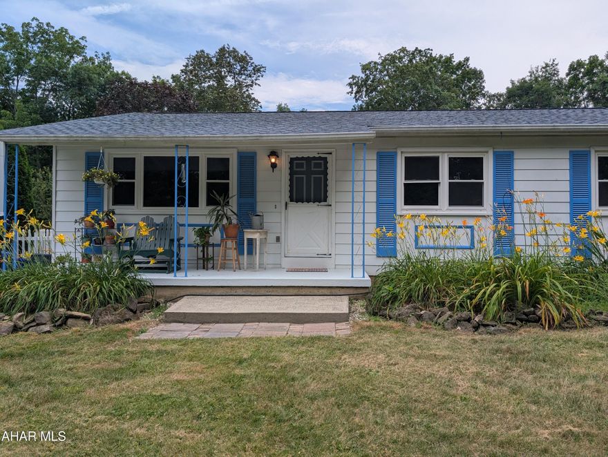 Tucked away in a peaceful, natural setting, this charming 3-bedroom, 2.5 bath ranch offers the perfect blend of comfort and self-sufficiency. Situated on 4.67 acres, the property features beautifully maintained pesticide free flower beds, vegetable gardens and an array of fruit trees and bushes-a true Gardner's paradise. Enjoy outdoor living under the expansive 30x32x8 foot pavilion or relax on the large covered concrete patio while taking in all that nature has to offer. Recent updates include a roof and drain field for peace of mind. The 1-car garage/shed are perfect for storage or hobbies. The basement features a cozy wood stove and space to use as you please to include laundry, a work area and wood stove. The Lower Trail entrance is one short mile from the house. This is a rare find for those seeking privacy, sustainability and the beauty of the outdoors-this Williamsburg gem will not last long! Virtual Matterport Tour available! Schedule your showing today!