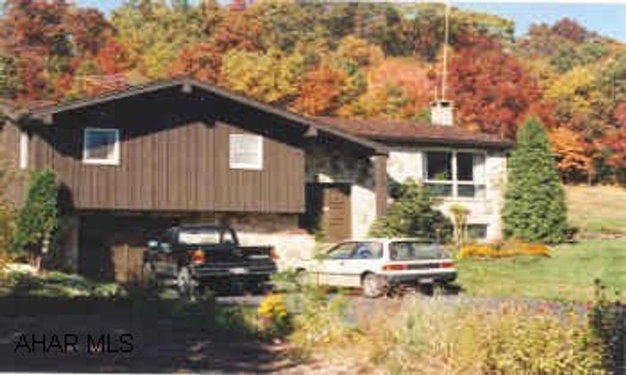 NATURE LOVERS PARADISE, RUSTIC STONE & CEDAR HOME ON 7.8 ACRES.  BIRDWATCHER & NATURE LOVERS DELIGHT. THIS STONE & CEDAR HOME SITS ATOP A MOUNTAIN ON 7.8 ACRES. ENJOY FRUIT TREES, ARTIST STUDIO, WRAP AROUND DECK & BREATHTAKING VIEW OF PA. PAVED LANE & EXTRA 2 CAR GARAGE. ROOT SELLER, GREENHOUSE AND SHED.