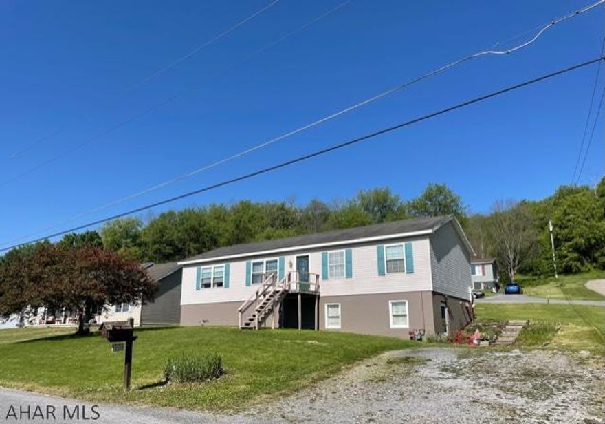 This well maintained and spacious modular home sits on a large corner lot. The large living room is open to the dining room, great for entertaining family and friends, the galley kitchen has new counter tops and back splash, laundry area is open to the kitchen and is connected by a door to the master bath. Large master bedroom with plenty of closet space. On the other side of the home, there is a large full bath, two bedrooms both with new flooring, and a large family room with sliding glass doors to the back. The large unfinished basement has high ceilings, it has been plumbed for a bathroom, and could be finished for additional living space. There are some newer windows and doors throughout. Enjoy the view off of the deck all year long! Call today!