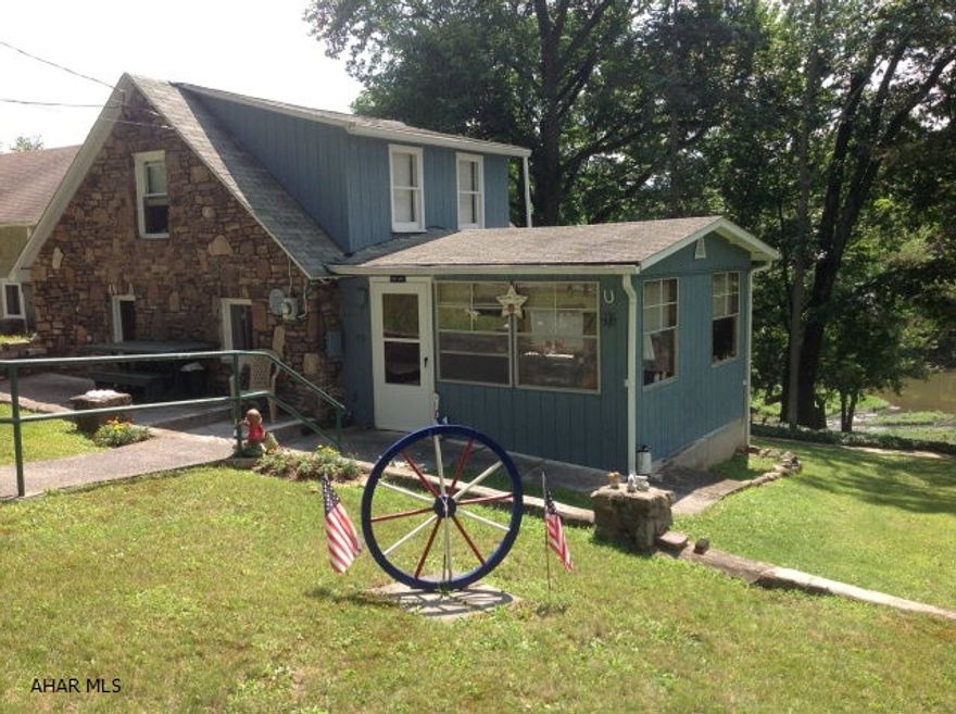THIS COTTAGE HAS BREATH TAKING VIEWS ALONG THE JUNIATA RIVER AND THE BEST THING IS THAT  THE COTTAGE IS NOT IN A FLOOD PLANE. THE PARTIALY STONE COTTAGE HAS GREAT CHARM WITH A SPACIOUS YARD OF MORE THAN A ACRE ALONG WITH A ONE CAR SPACIOUS GARAGE AND STORAGE BUILDING.IT HAS A WELL AND PUBLIC SEWER BUT ALSO CAN TAP ON TO PUBLIC WATER IF SO DESIRE . If U ARE LOOKING AT A COTTAGE ON RIVER AT A GREAT PRICE, YOU HAVE FOUND IT.  Survey will determined correct acreage.