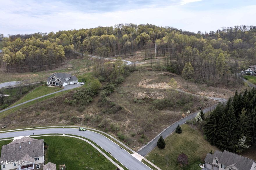 A unique opportunity to own a lot in one of the most prestigious developments in the county with arguably one of the BEST views!  This amazing lot is over 2 acres with lots of privacy and breathtaking views.  Utilities are available including city water, city sewer, natural gas, and electric.  Lot lines in white are approx.