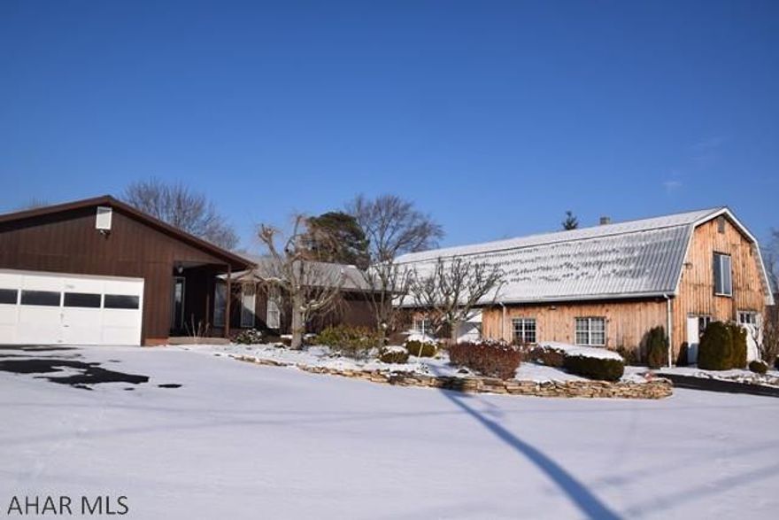 Very unique property!  Nice, comfortable home with a large commercial building that has heat on one side.  Perfect for retail or for someone with a home business or hobby that requires lots of space.   Home is well maintained and has a nice, level lot.   There are two large bedrooms including a  master with a 3/4 bath and very large walk-in closet.  Nice laundry room.  The possibilities are endless with this property!