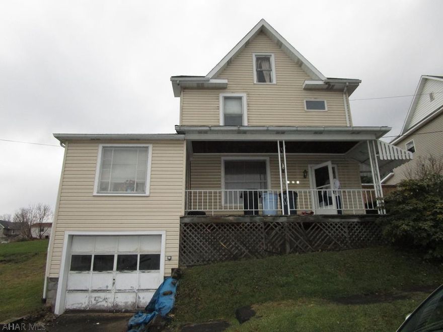 Large 2 story 3 bedroom vinyl sided home. Kitchen, living room, dining room, den and laundry room on first floor.   Interior needs some updating. Great price for a handy man!