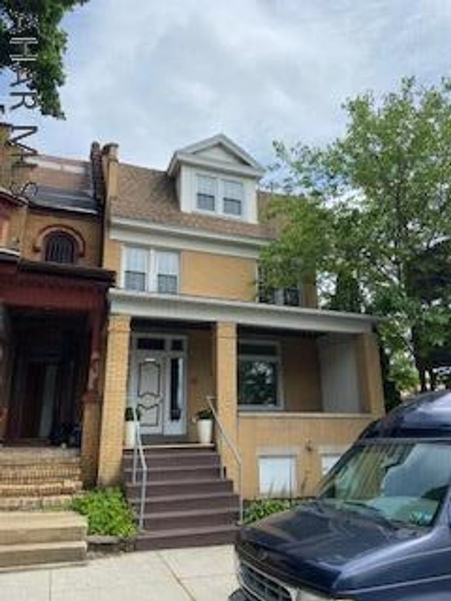 Brick 4 bedroom home with a large covered front porch and a fenced in back yard. Could be a five bedroom with the addition of heat in one of the rooms on the third floor. New carpet installed. Move in ready.