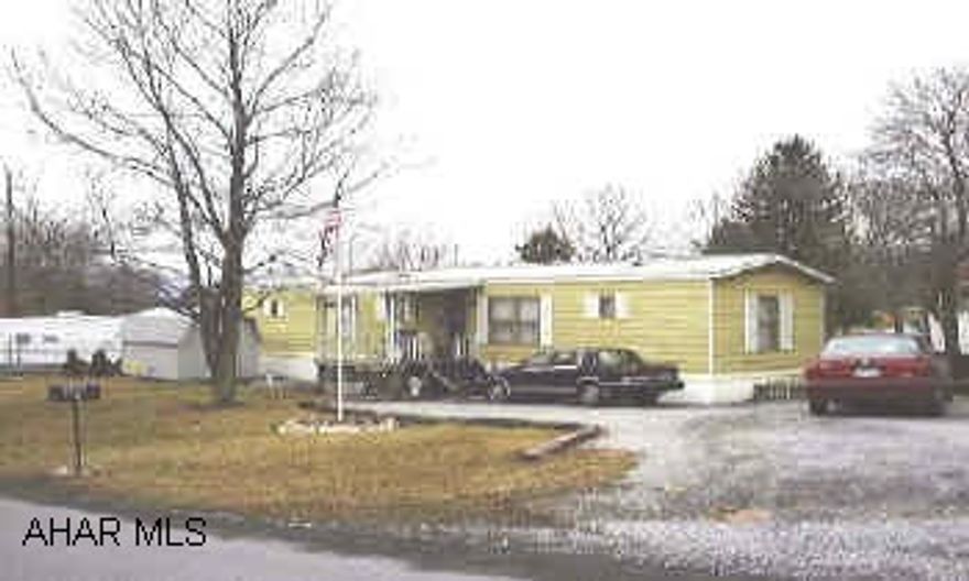 Larger well maintained mobile home with nice lot.