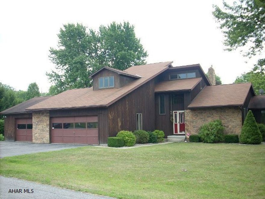 Unique Contemporary!  Highly sought after Bellwood location.  Kitchen offers an abundance of natural light and includes all appliances.  The formal dining room features a large bay window that overlooks the large private deck.  Cathedral ceilings top the spacious living room that boasts a stone fireplace and open balcony.  First floor master bedroom suite with sliders to the deck.  A great buy in Bellwood!